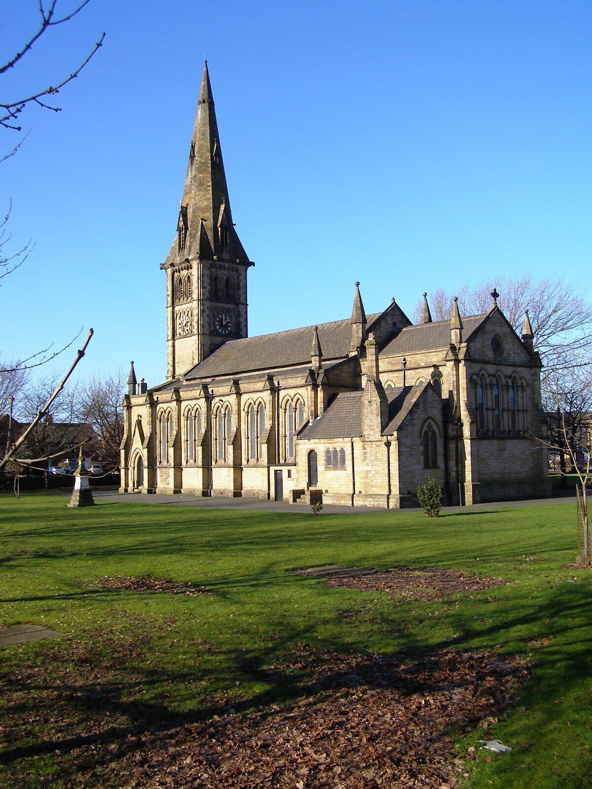 A historic church with a tall spire and clock tower.