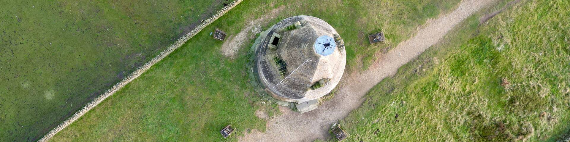 Aerial view of the tower at the top of the Hartshead Pike hill in Ashton-under-Lyne, England
