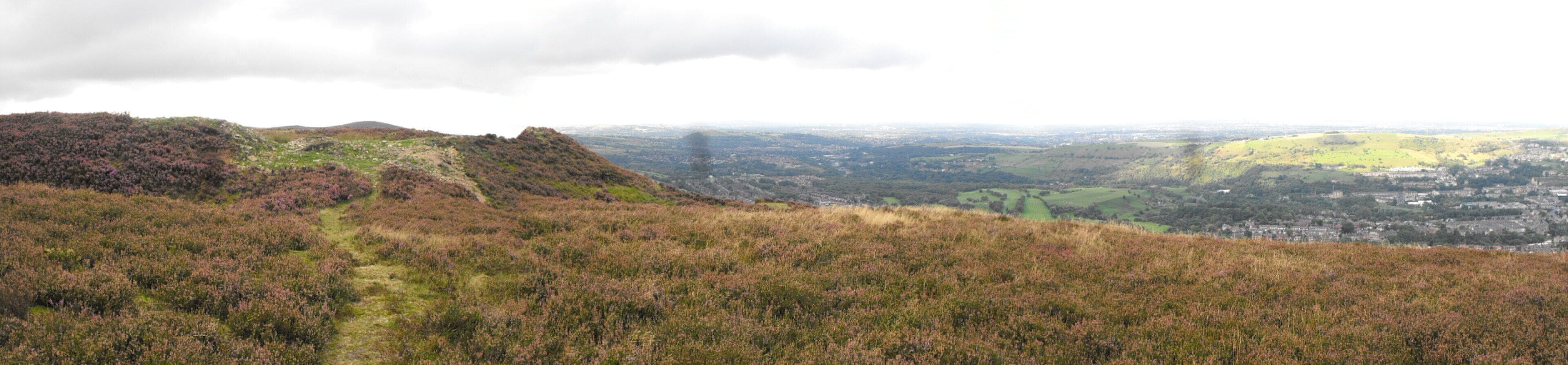 The causeway to Buckton Castle (left) and the view to the west (right)