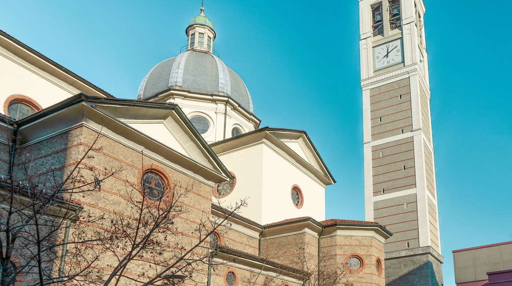 The side of church of Saint Stephen Protomartyr, with bell tower and dome, in Luigi Petazzi square, Sesto San Giovanni, municipality of Milan, Lombardy region, Italy