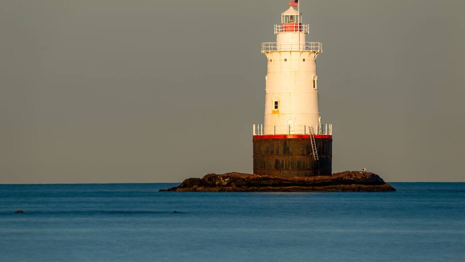 07/10/2022 - Little Compton, RI USA - Early morning image of the Sakonnet Point Light (West Island Light) between Little Compton and Tiverton Rhode Island, at Sakonnet River and Atlantic Ocean.