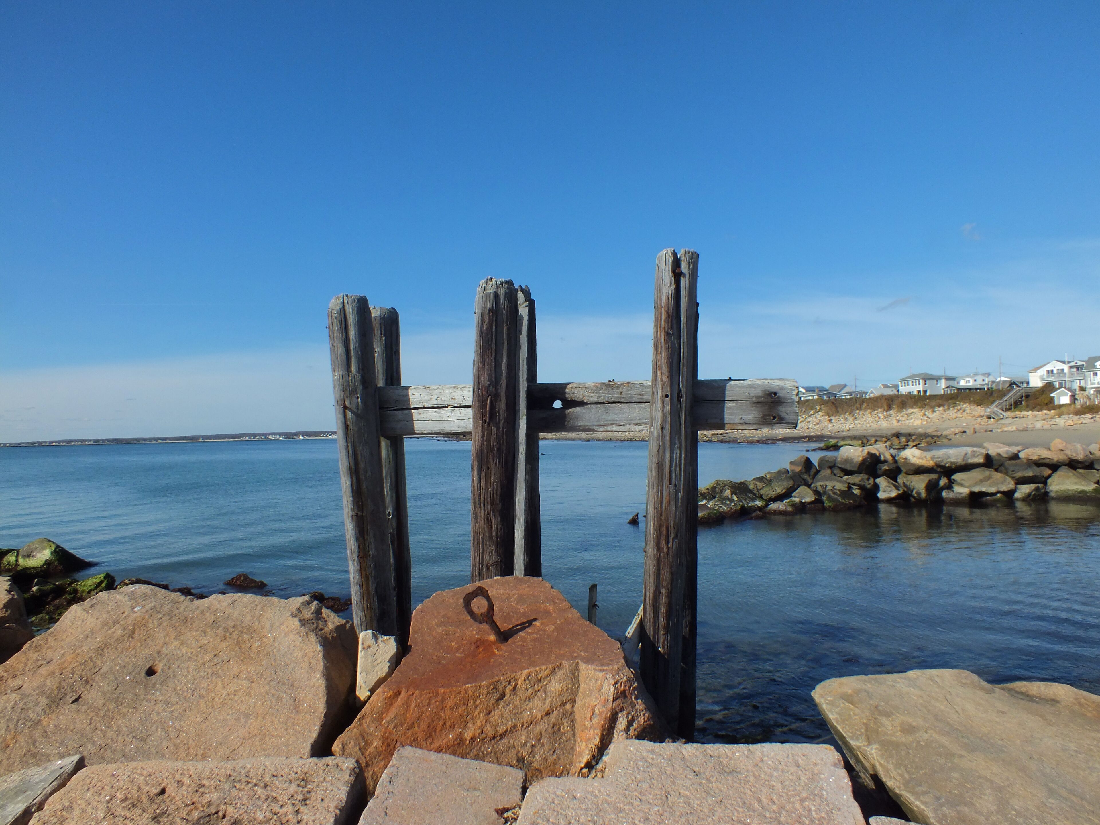 The sea and blue sky at Point Judith in Narragansett (Rhode Island). This beach is part of Breakwater Village, a complex of old, small wooden houses, most of them vacation apartments | Atlantic Ocean;
