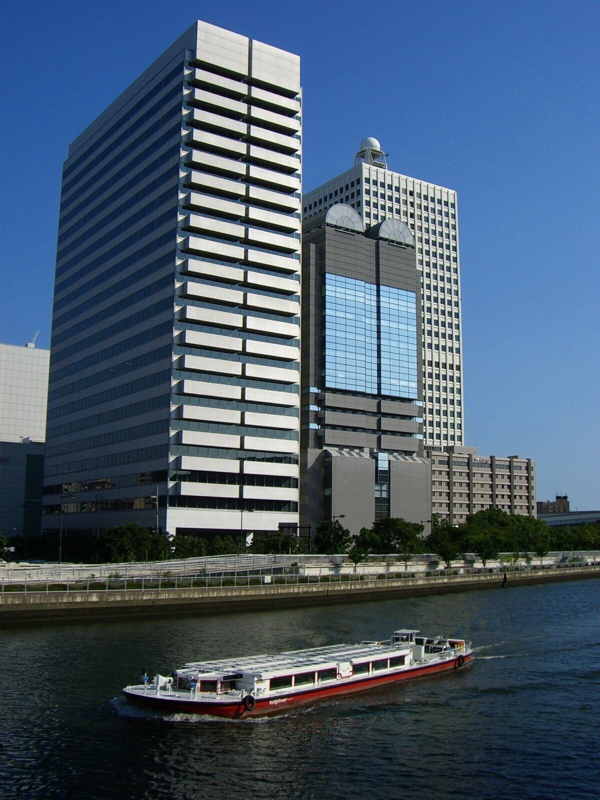 Buildings at Nakanoshima 6 chome and Ship on Dojima-gawa river, Osaka City, japan