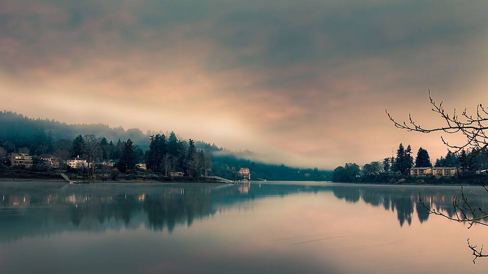 Riverwood and Milwaukie on opposite sides of the Willamette River, Cloudy sky, still water, long exposure, seen from Milwaukie Bay Park at dawn