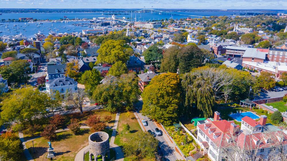 Touro Park aerial view including Windmill Tower with Newport Harbor at the background, city center of Newport, Rhode Island RI, USA.