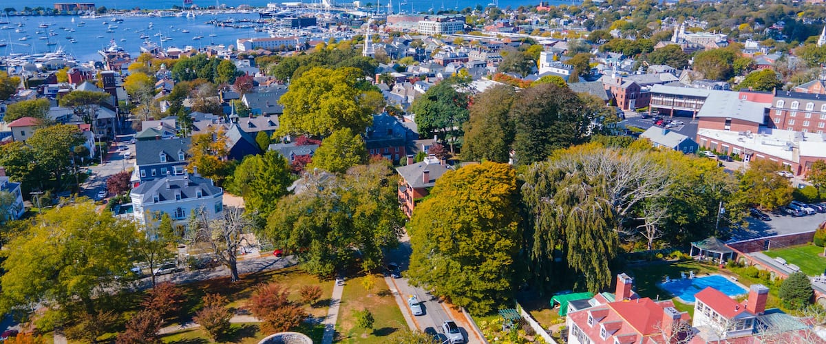 Touro Park aerial view including Windmill Tower with Newport Harbor at the background, city center of Newport, Rhode Island RI, USA.