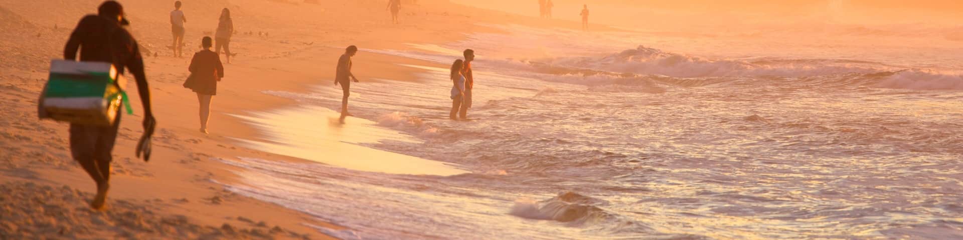 Copacabana Beach showing a sunset, mist or fog and a beach