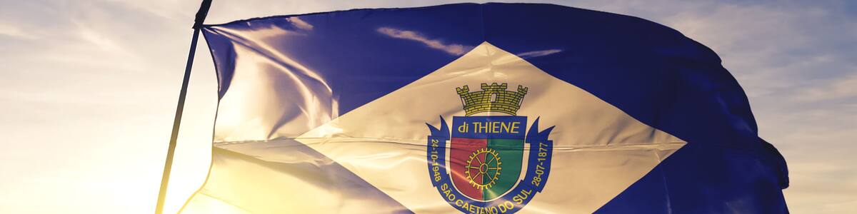 Sao Caetano do Sul of Brazil flag waving on the top sunrise mist fog