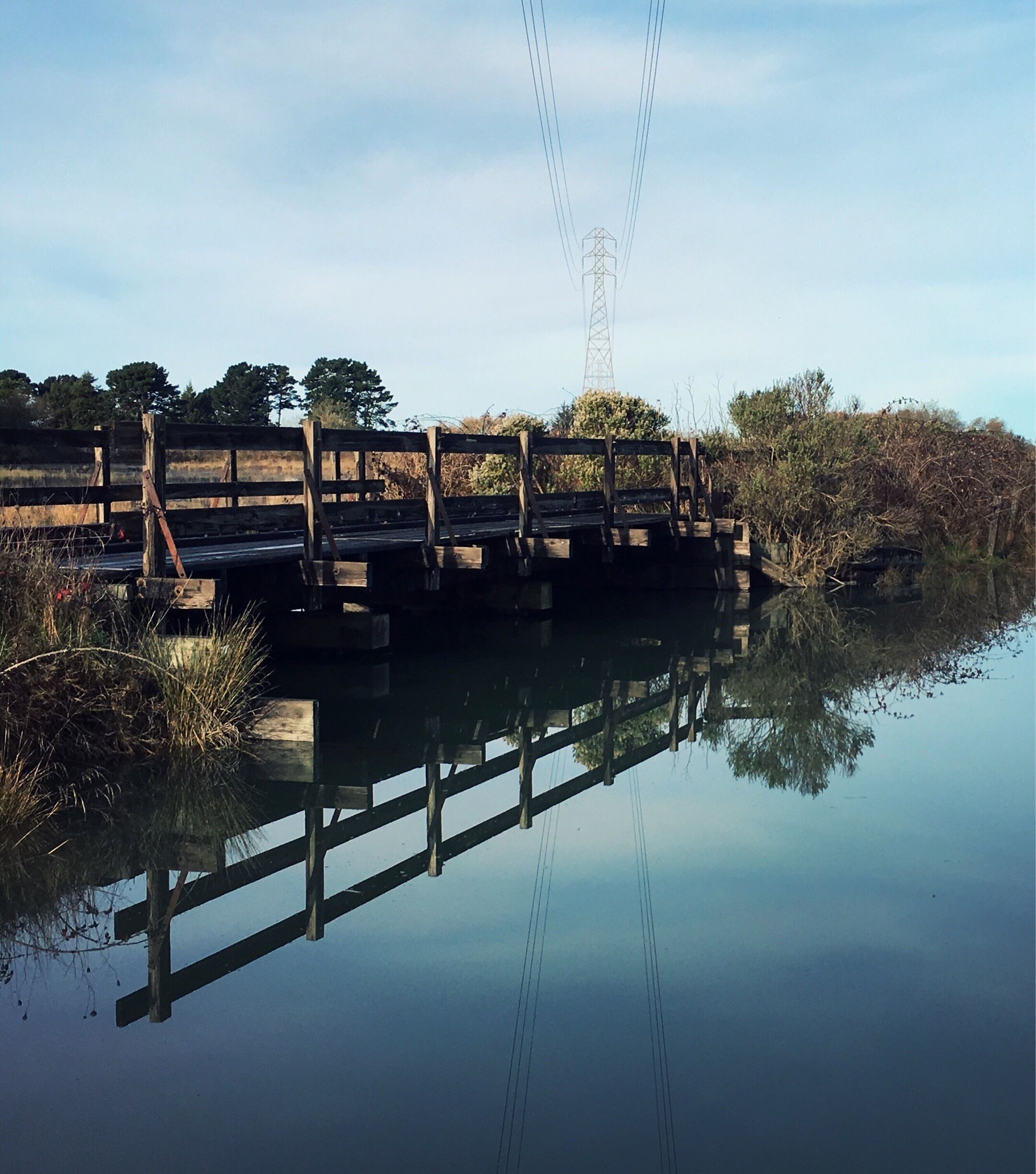 A pedestrian bridge connecting marsh paths near the interpretive center