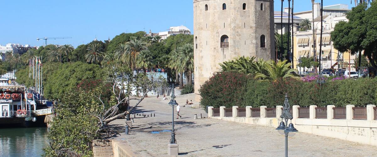 The Torre del Oro (Golden Tower) on the banks of the Guadalquivir, Seville taken from the Puente de San Telmo. Construction in the 13th century by the Almohad Caliphate to control access to Seville. The tower reached its present form in 1769. It is currently a museum.