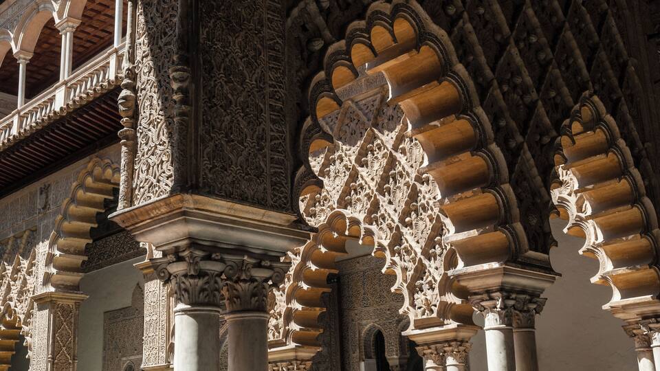 Intricate architectural details of a historic building with ornate arches and columns.