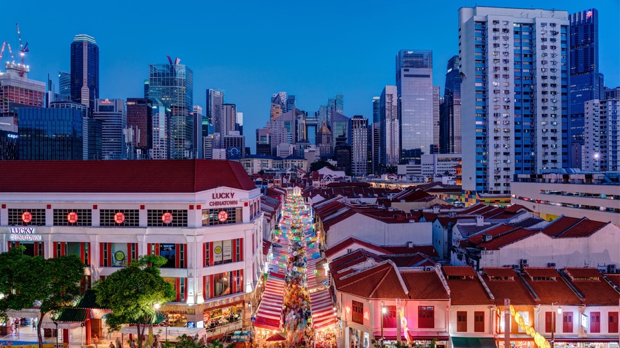 A cityscape with a prominent building labeled 'Lucky Chinatown' and a traditional Chinese lantern display.