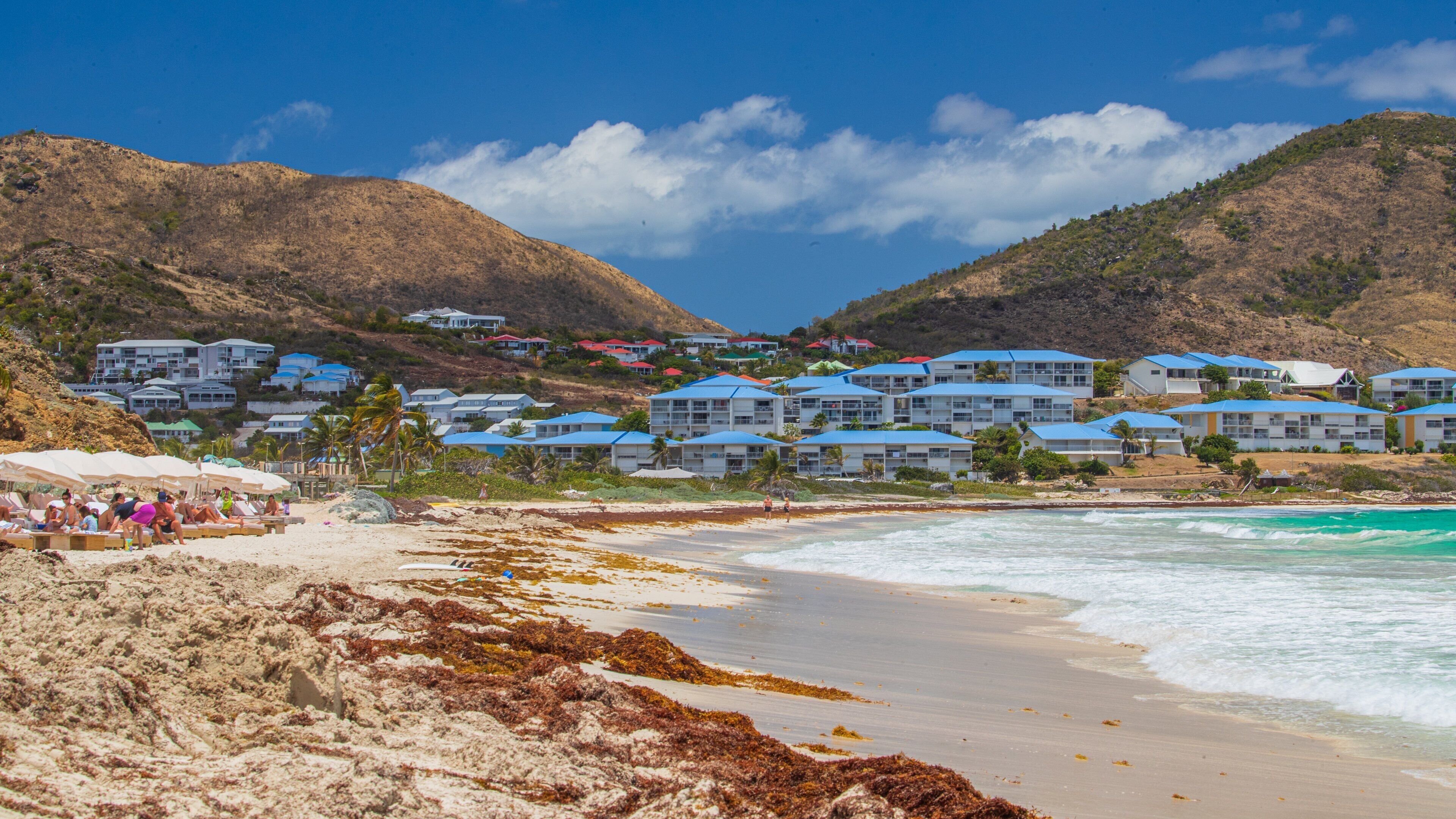 Orient Bay Beach showing a beach, a coastal town and general coastal views