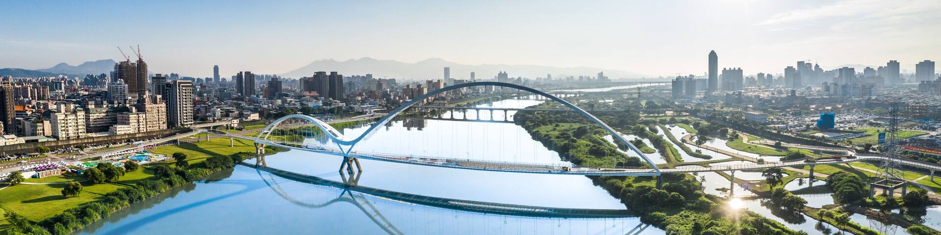 Crescent Bridge - landmark of New Taipei, Taiwan with beautiful illumination at day, aerial photography in New Taipei, Taiwan.