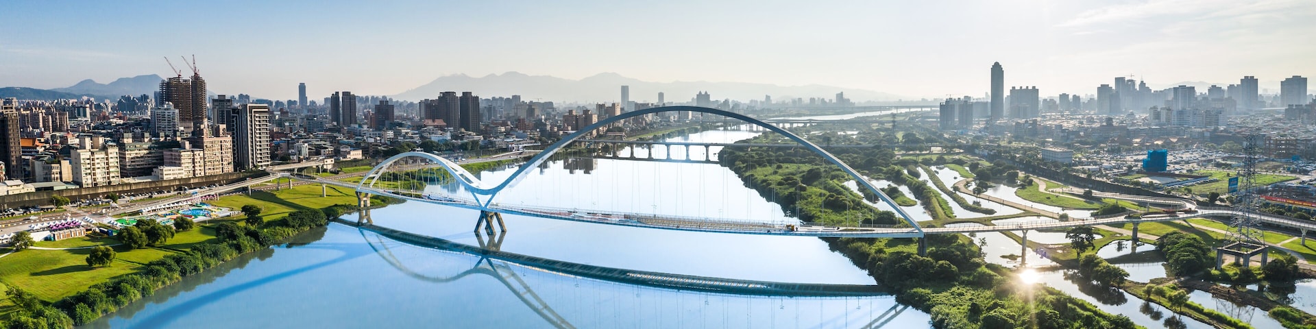 Crescent Bridge - landmark of New Taipei, Taiwan with beautiful illumination at day, aerial photography in New Taipei, Taiwan.