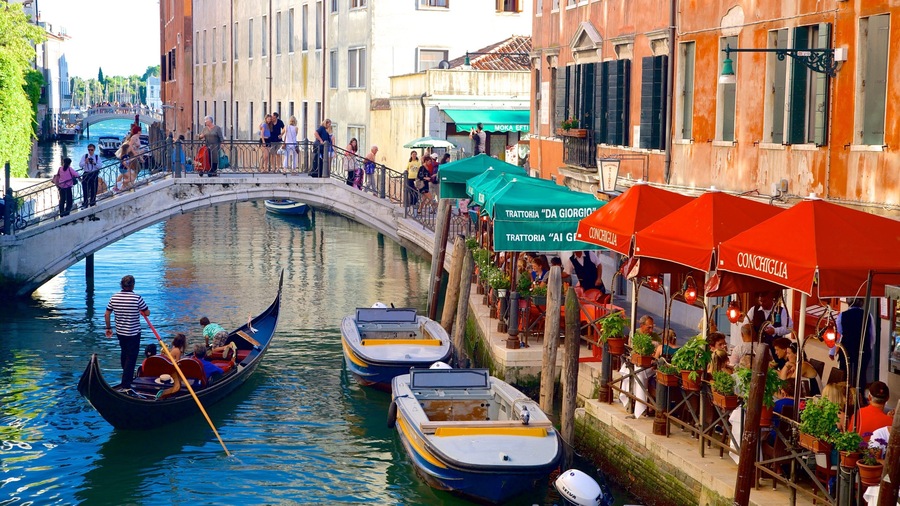 Castello showing kayaking or canoeing, a bridge and a river or creek