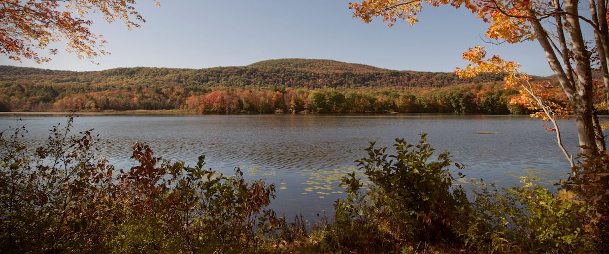 An autumn view of Cheshire Lake in the Berkshire Mountains of Western Massachusetts.
