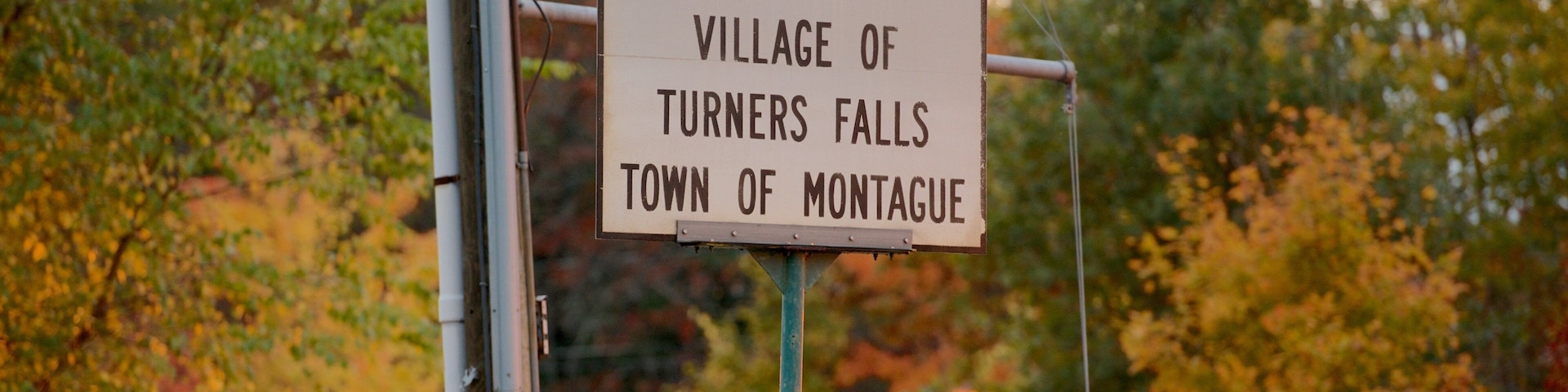 Turners Falls which includes signage and fall colors