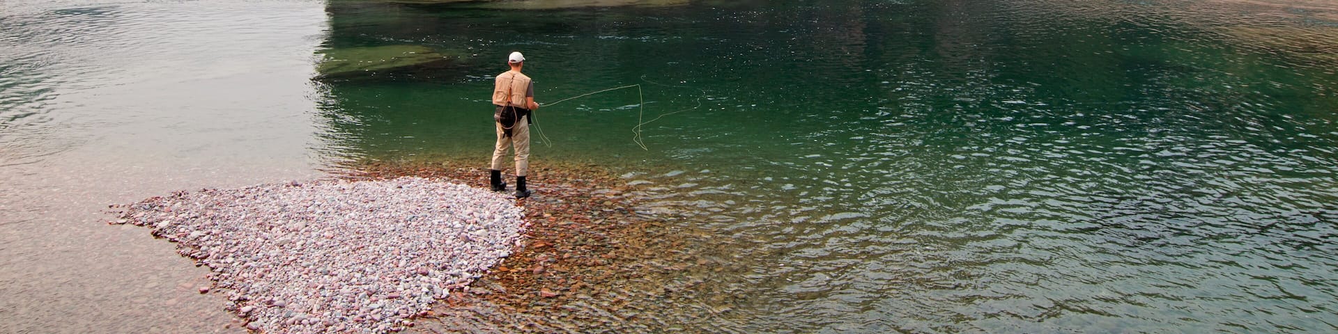 Fly fishing at the confluence of the Flathead and Spotted Bear Rivers in the Bob Marshall wilderness area during the 2017 fall fires in Montana United States