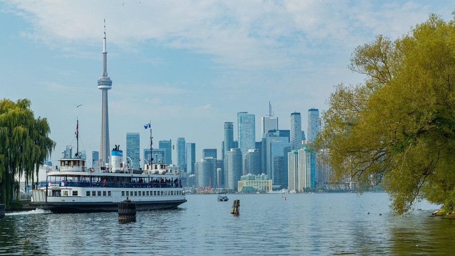 Toronto Islands which includes a city, a ferry and a bay or harbor
