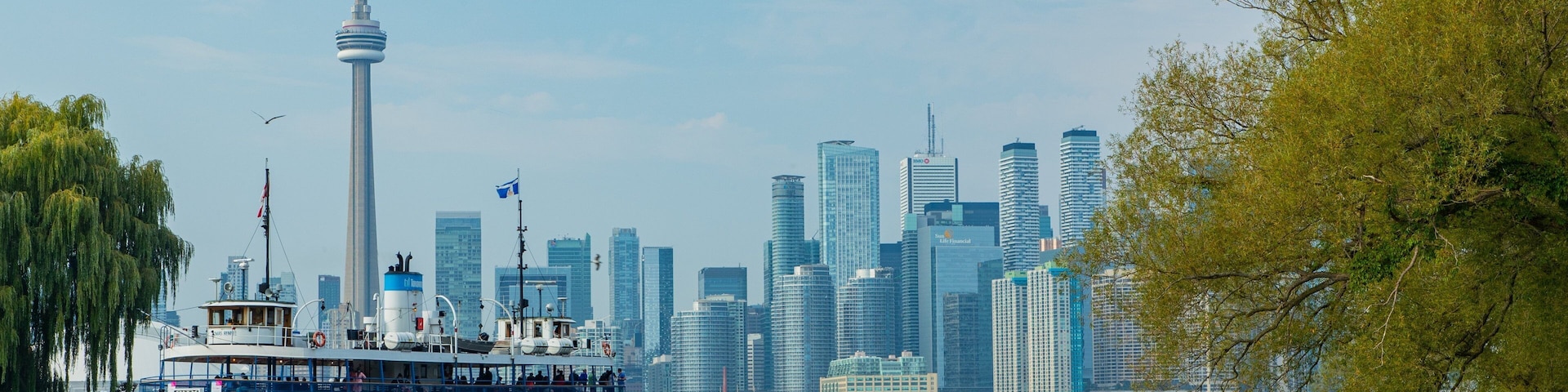 Toronto Islands which includes a city, a ferry and a bay or harbor