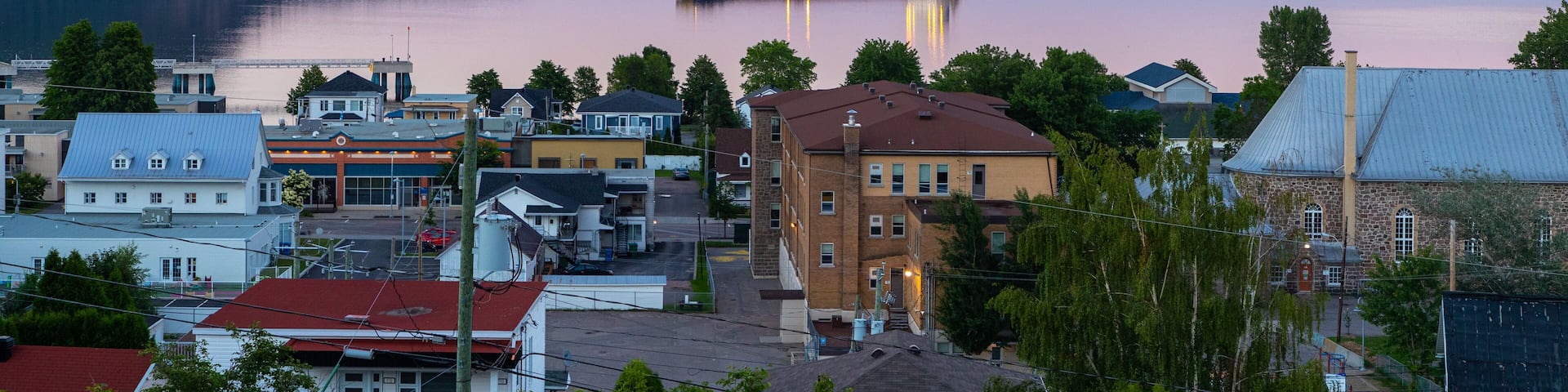 La Baie featuring a sunset, a coastal town and general coastal views