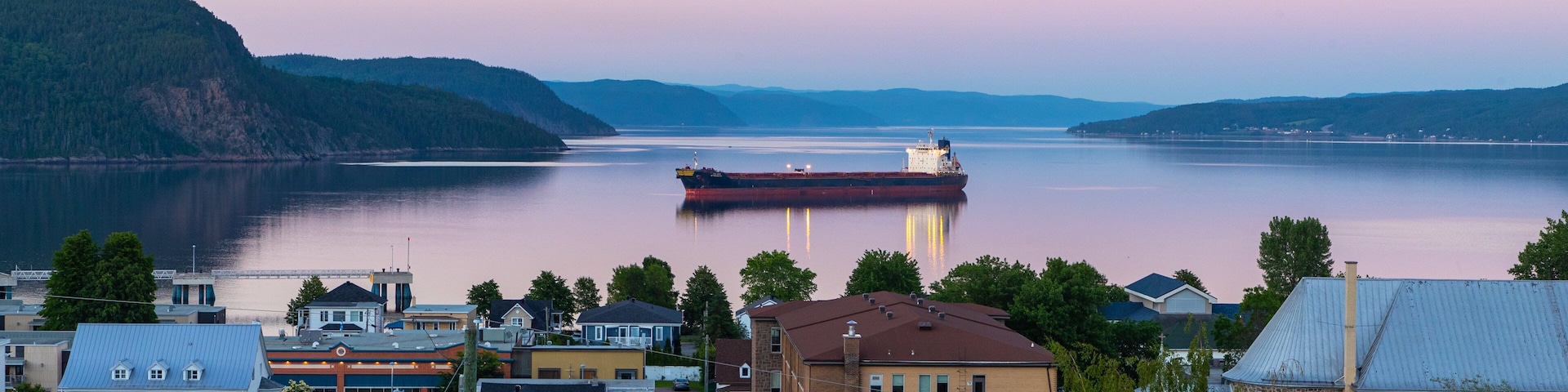 La Baie featuring a sunset, a coastal town and general coastal views
