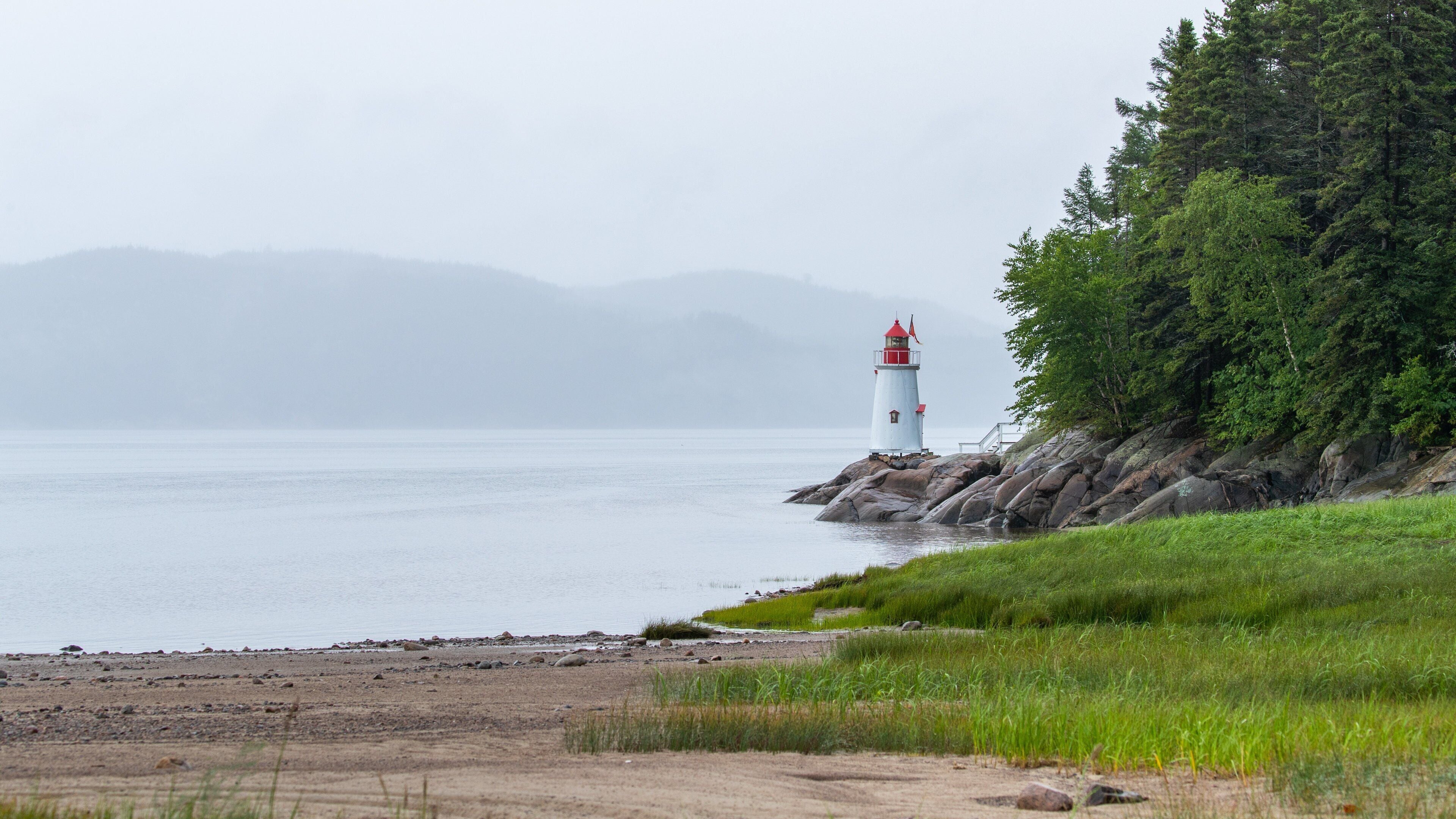 La Baie featuring mist or fog, general coastal views and a lighthouse
