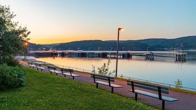 La Baie which includes a garden, a river or creek and a sunset