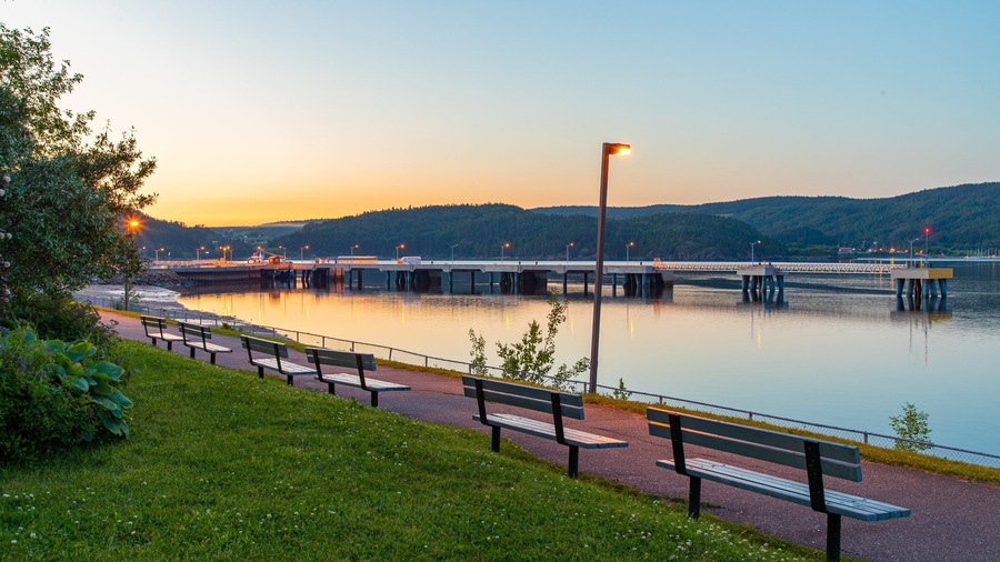 La Baie which includes a garden, a river or creek and a sunset