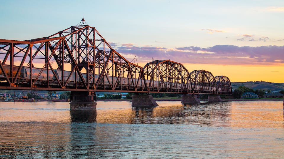 Sunset Over Historic Train Bridge in Fort Pierre, South Dakota with Train on Missouri River