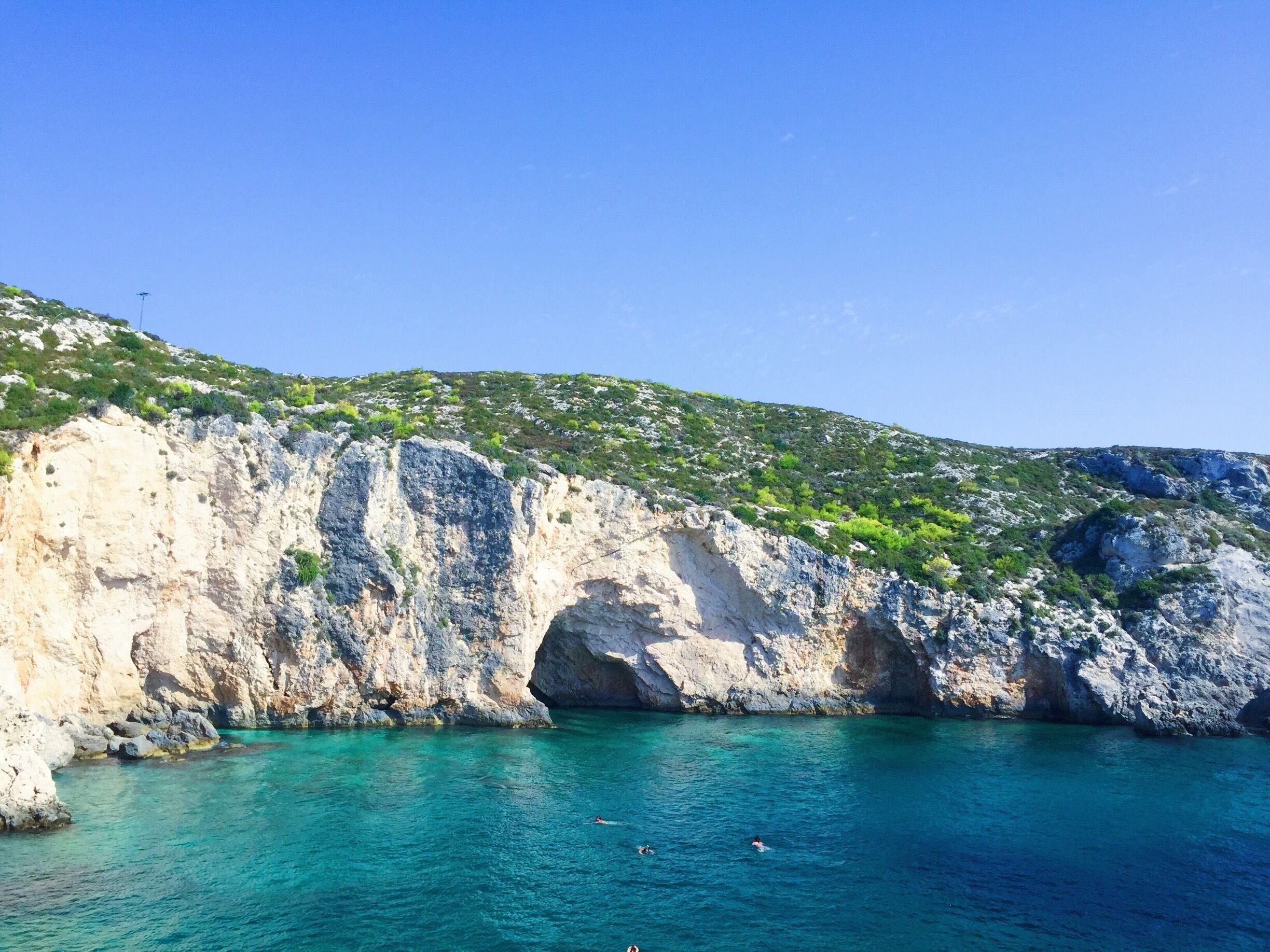 One of the best places we swam in Zakinthos. So many awesome caves to explore and the water was spectacular! #greece #greekislands #cliffs #blue #zakynthos #caves #nature