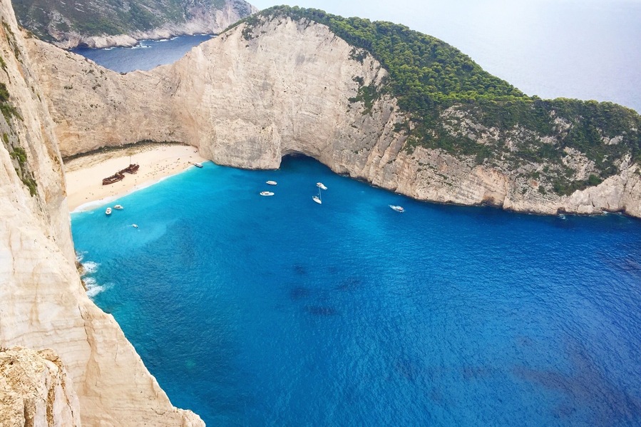 I can't believe how blue the water was here!! It was an amazing view from the top and an amazing view from the beach. #greece #shipwreck #zakynthos #cliffs #blue #aquatrove