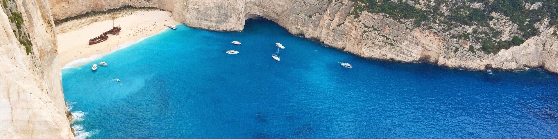 I can't believe how blue the water was here!! It was an amazing view from the top and an amazing view from the beach. #greece #shipwreck #zakynthos #cliffs #blue #aquatrove