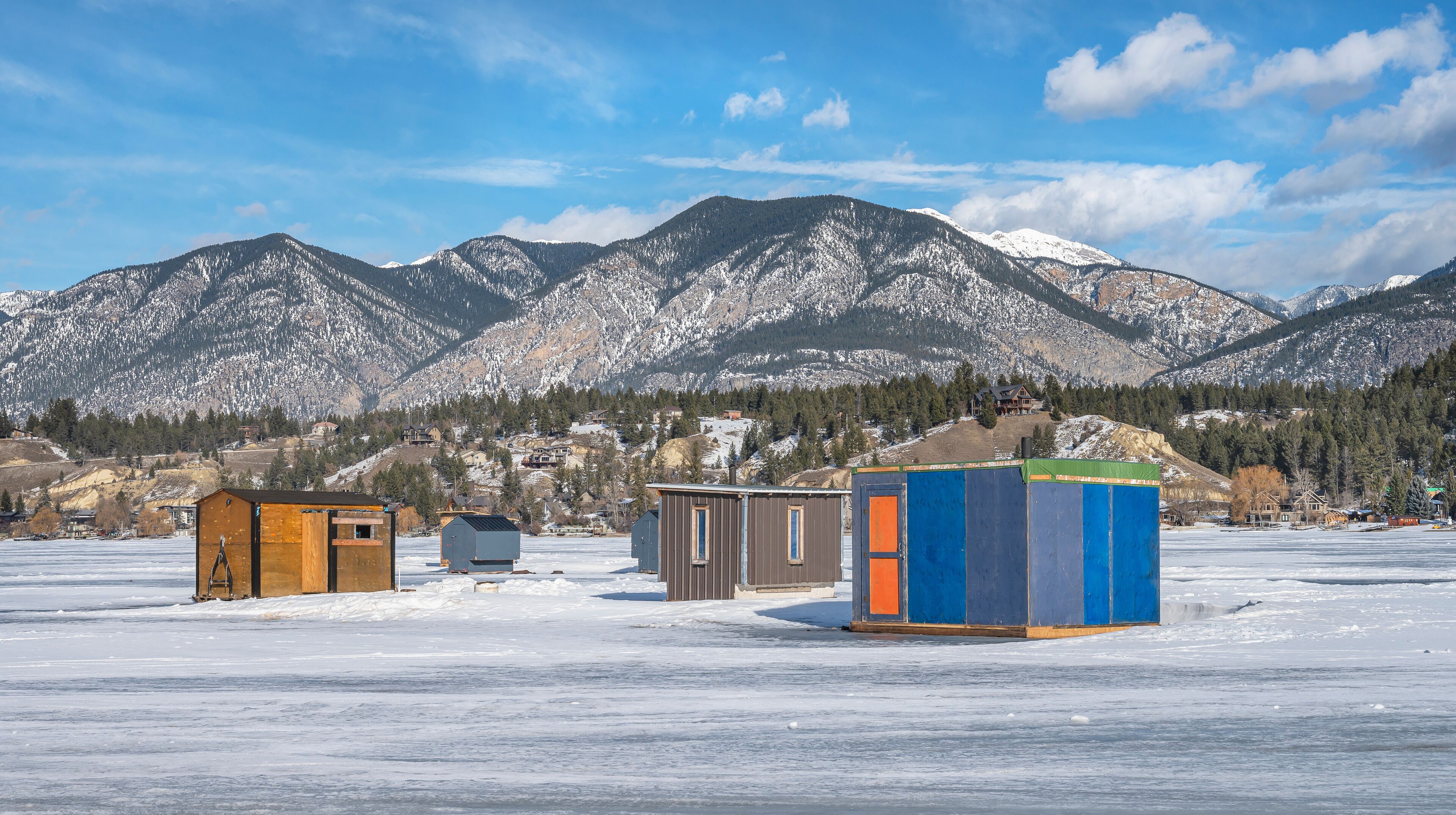 Ice fishing shacks on Lake Windermere at Invermere, British Columbia, Canada