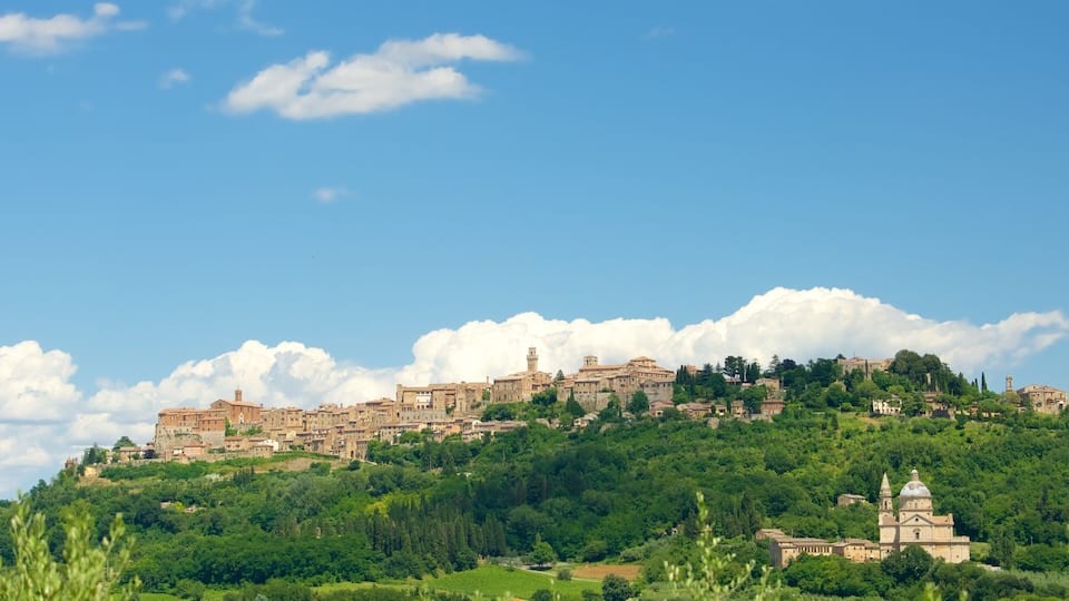 A historic town on a hill with ancient buildings and a church.
