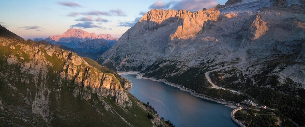 When you climb up the mountains above Fedaia lake you will see some breathtaking views. Fedaia lake is best to be shot at sunset. When you go there at sunrise you might get some really good light on the west valley view.
East view like this offers both lake and mountains in your composition. On the Right upper corner you can see part of Marmolada iceberg.
#BvSApplication #BVSBlue