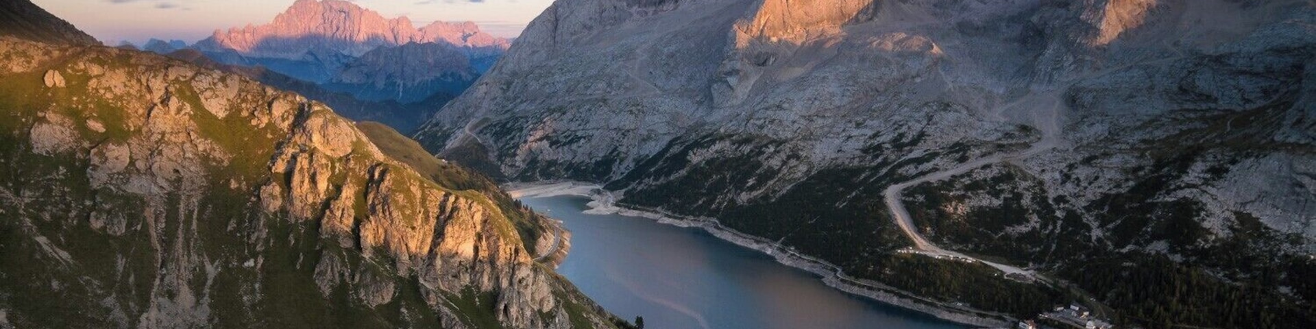 When you climb up the mountains above Fedaia lake you will see some breathtaking views. Fedaia lake is best to be shot at sunset. When you go there at sunrise you might get some really good light on the west valley view.
East view like this offers both lake and mountains in your composition. On the Right upper corner you can see part of Marmolada iceberg.
#BvSApplication #BVSBlue