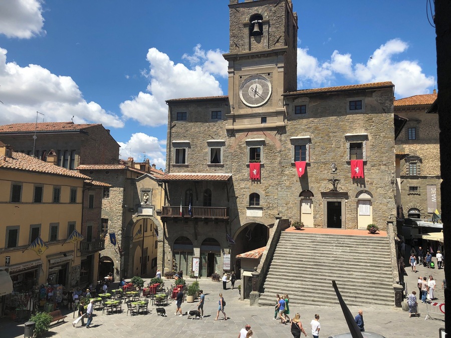 As in Under the Tuscan Sun.  Be ready to walk, up and down, but the views of the country side and the food/wine around this piazza with clock tower will convince you this is pretty close to heaven.