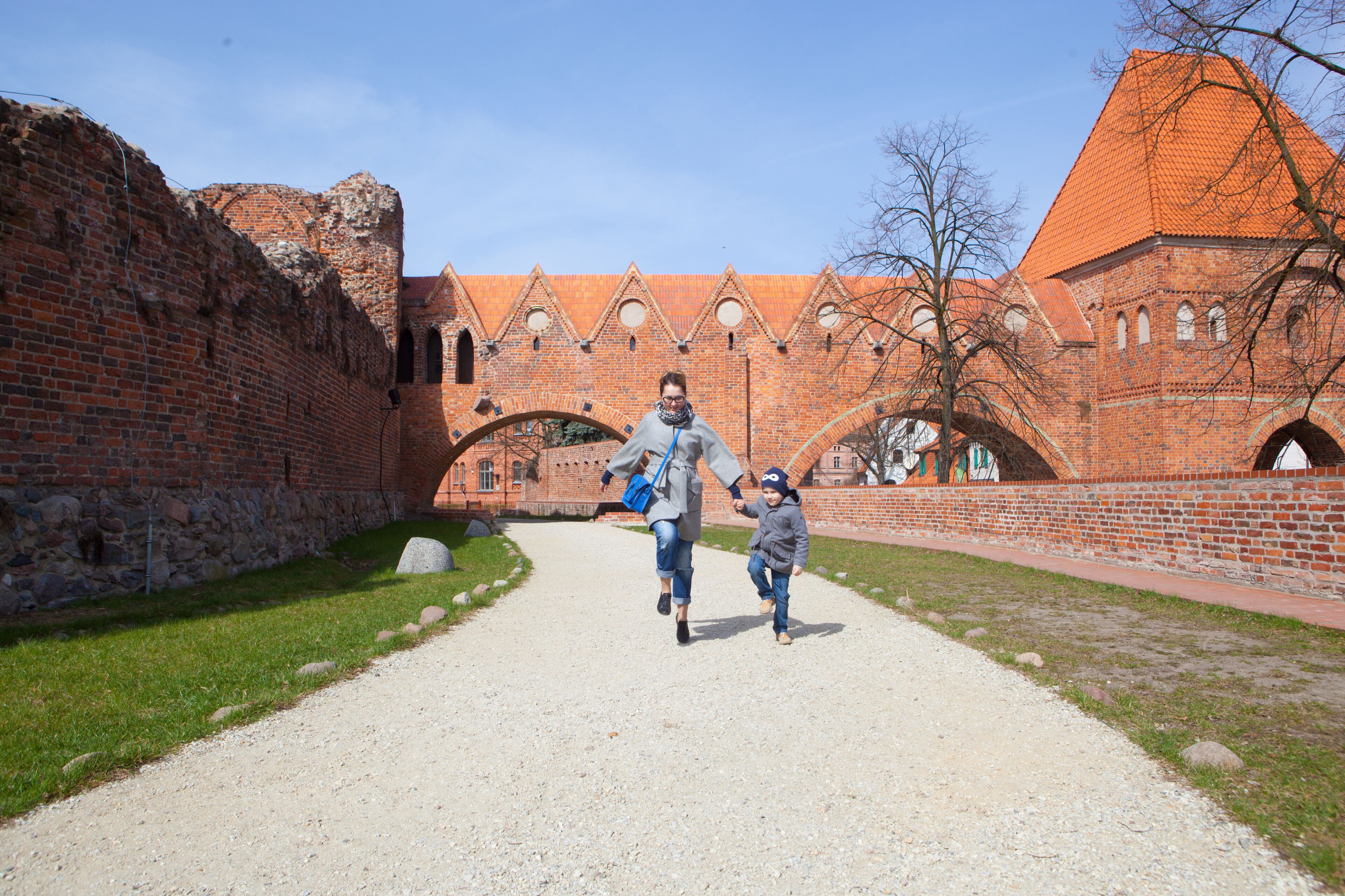 Mother and son in old town Torun. Poland