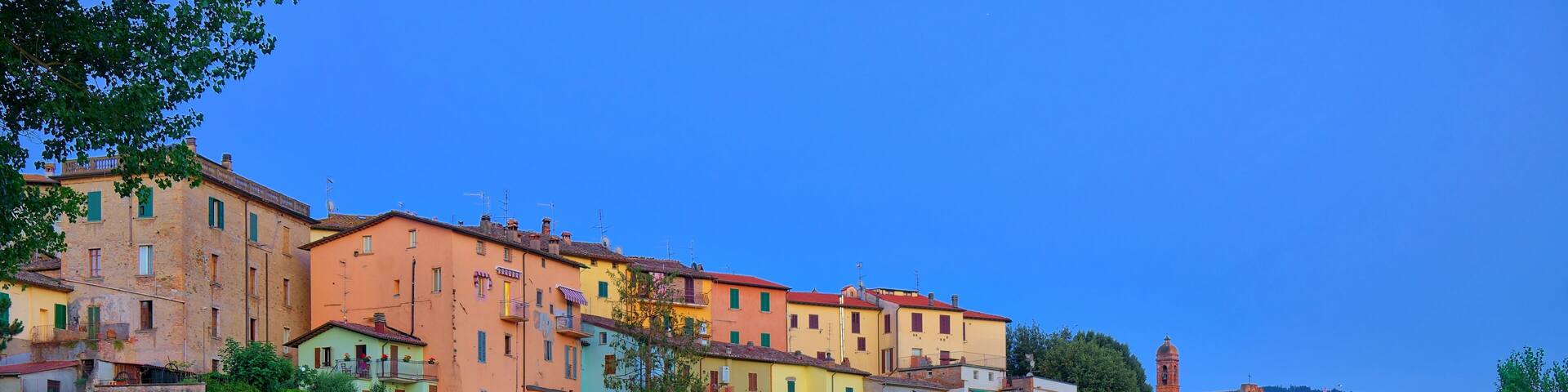 Old city reflection in Tevere river, Umbertide, Italy