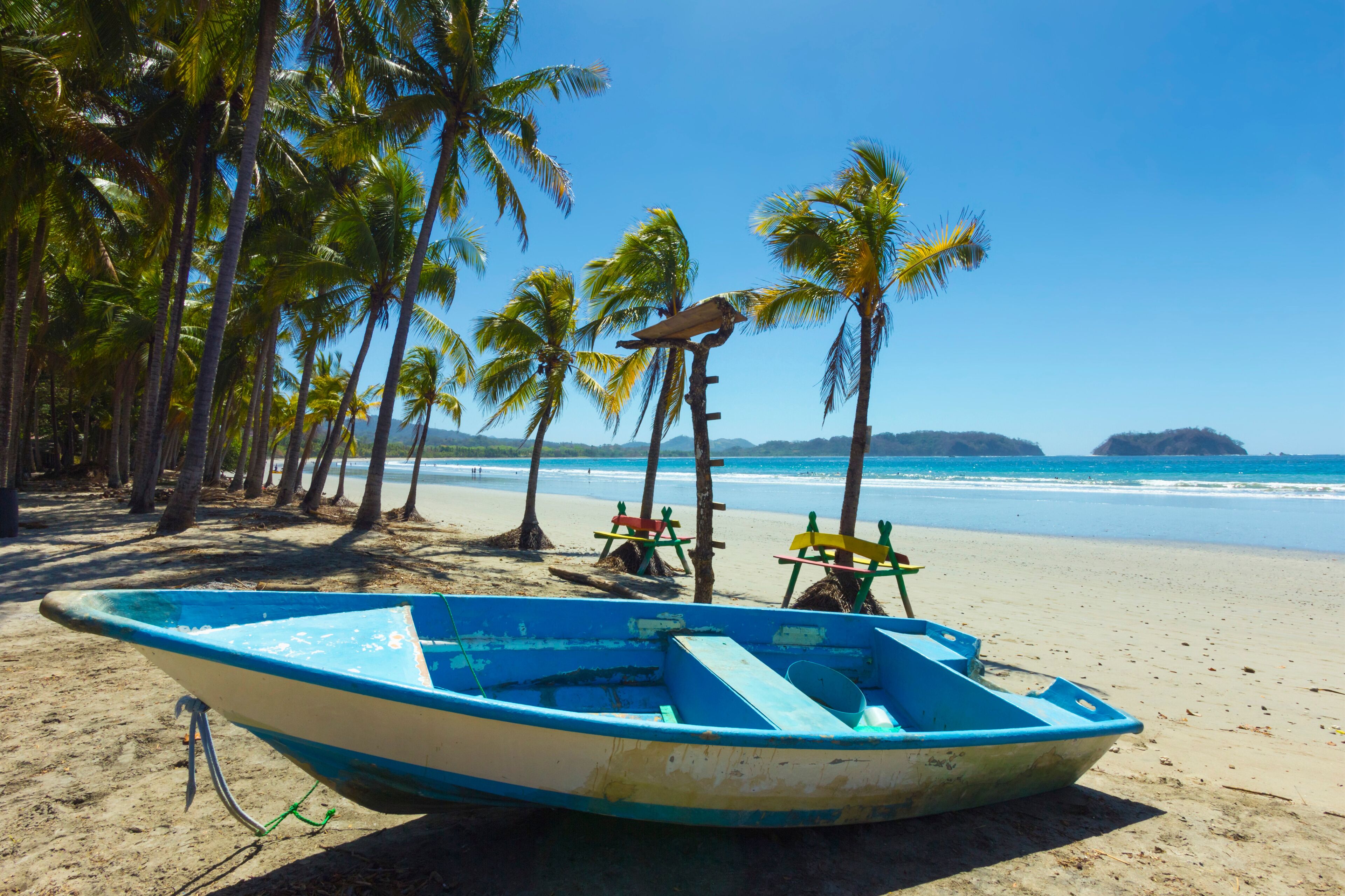 Boat on the palm-fringed beach at this laid-back village & resort, Samara, Guanacaste Province, Nicoya Peninsula