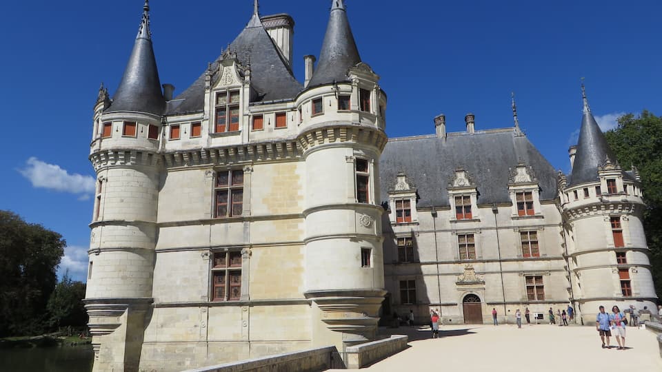 A historic castle with multiple towers and a large courtyard.