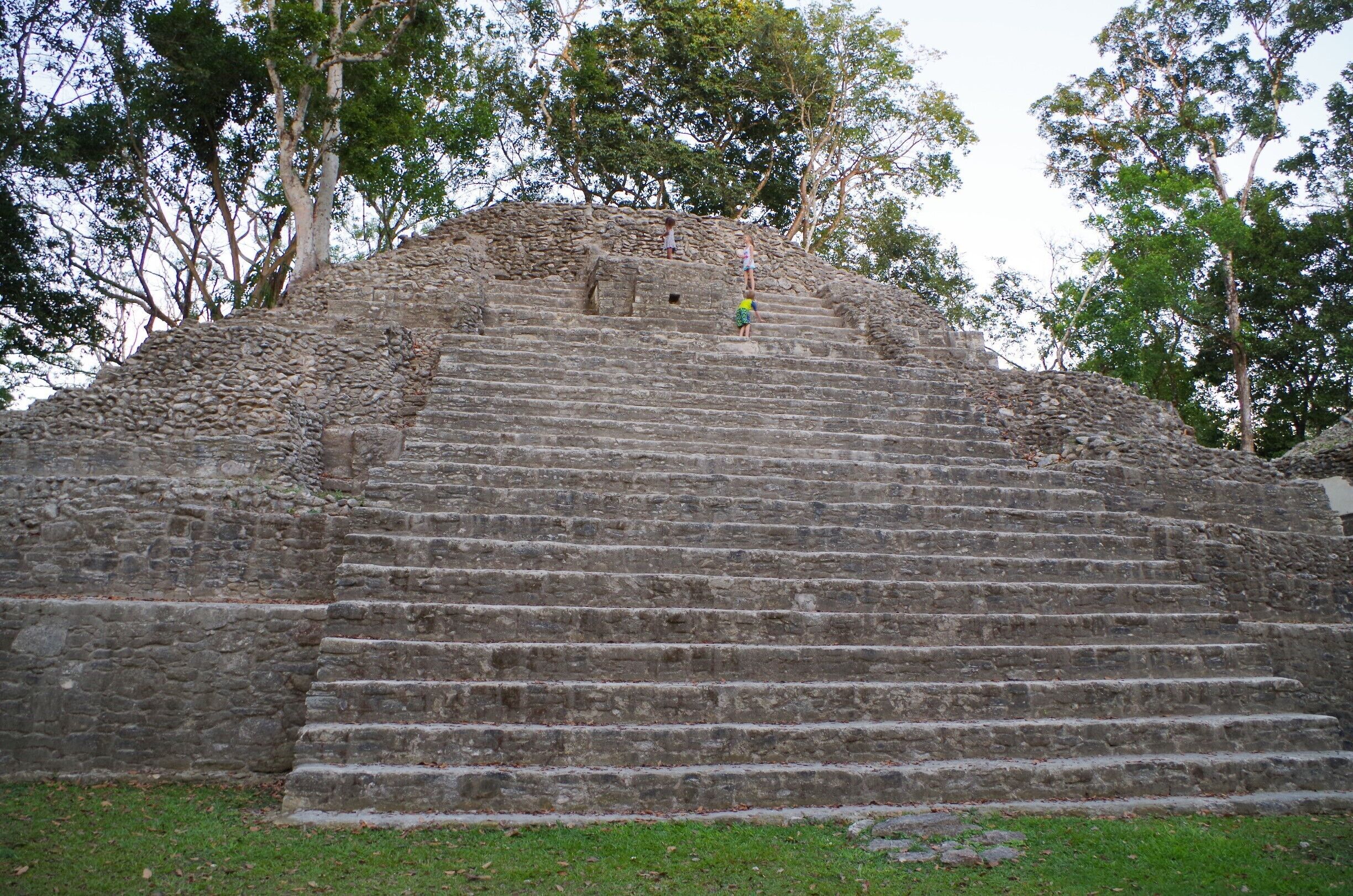 Cahal Pech is a Maya site located near the Town of San Ignacio in the Cayo District of Belize. The site was a palatial, hilltop home for an elite Maya family, and though most major construction dates to the Classic period, evidence of continuous habitation has been dated to as far back as 1200 BCE during the Early Middle Formative period, making Cahal Pech one of the oldest recognizably Maya sites in Western Belize. The site rests high above the banks of the Macal River and is strategically located to overlook the confluence of the Macal River and the Mopan River. The site is a collection of 34 structures, with the tallest temple being about 25 meters in height, situated around a central acropolis. The site was abandoned in the 9th century CE for unknown reasons.