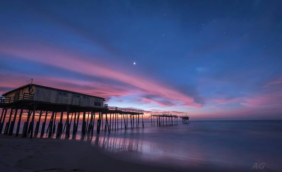 "Yin and Yang"
I was at Cape Hatteras last month to try and capture a sight of one of our heavenly visitors in the night sky - Comet Catalina. The comet is somewhat unique since this would be it's only ever visit to the inner Solar System before being ejected to interstellar space forever. It was by no means an easy target to locate and photograph in the night sky especially for someone who's never done that before.
But this is not about my attempts at capturing Comet Catalina (although I did manage to view and capture it). After I was done looking at the comet, I settled by the beach next to this pier, one of my favorite places on the North Carolina Outerbanks, to hear the ocean's mesmerizing soundtrack. I still had about 2 hours to go before sunrise and so I was just sitting and enjoying the unseasonably warm winter in December and just looking at the stars, Venus, Jupiter and Mars in the night sky. I suddenly noticed this big cloud about 5 minutes in streaking just below bright Venus. On a hunch, I decided to capture an image to see what the cloud looked like and a short 15 second later, I saw the start of what turned out to be one of the most perfect sunrises I have borne witness to. The cloud had started to just pick up the first rays from the sun, with about an hour and a half to go before sunrise.
I love the juxtaposition of every single element in this image. The fading of the night sky and stars with Venus shining valiantly as the sun comes back to herald the start of another day, the stretch of unbroken cloud over the hurricane damaged pier and the sheer beauty created in an otherwise damaging act of Mother Nature (the hurricane, not the sunrise :) ). This duality is what inspired the title of the image.
If you're near the NC coast, this location is a must stop. It is close to the town of Buxton and the Cape Hatteras Lighthouse.
Thank you for stopping by.
#colorful #goldenhour #hiking #weekend #roadtrip #waterlust #OBX #NC #USA #Pier #Frisco #CapeHatteras #abandoned #beach #beaches #blue #bestof5 #lovemytown