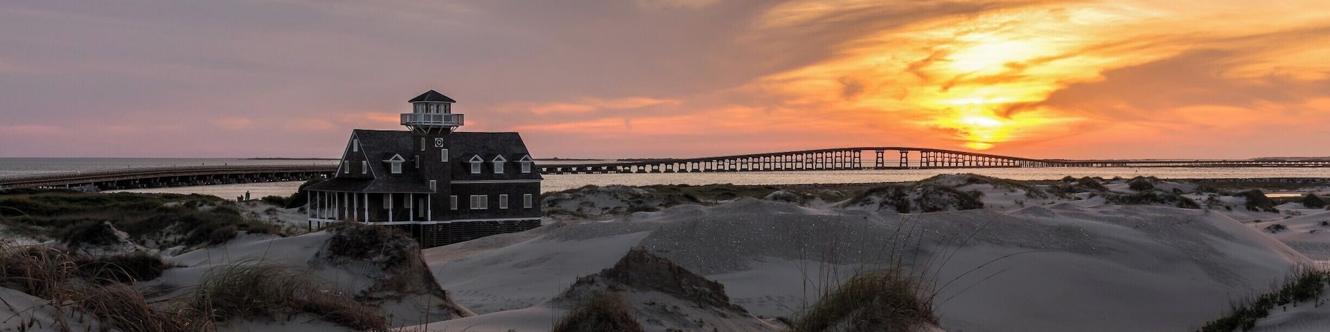 Bonner Bridge is one of North Carolina's most well known man-made structures of it's kind (The Linn Cove Viaduct on the Blue Ridge Parkway is probably the most well known). This location makes for a great getaway at the Outerbanks to spend an entire day (and night). The location is popular for fishing and is ideal for landscape and astro photography. You can have lots of fun on some of the dunes, although getting the sand out afterwards is a big hassle.
This is one of my favorite images from this location. I love the warm light tones and the shadows that create a contrast in the foreground sand. It is created from a single exposure with only minor modifications made to adjust overall contrast and brightness.
If you are interested in wildlife, the Pea Island Wildlife Refuge is nearby and is a very popular location.
Thank you for stopping by.
#NC #Sunset #Bridge #OBX #BonnerBridge #colorful #roadtrip #weekend #goldenhour #beaches #abandoned #USA #beach #history