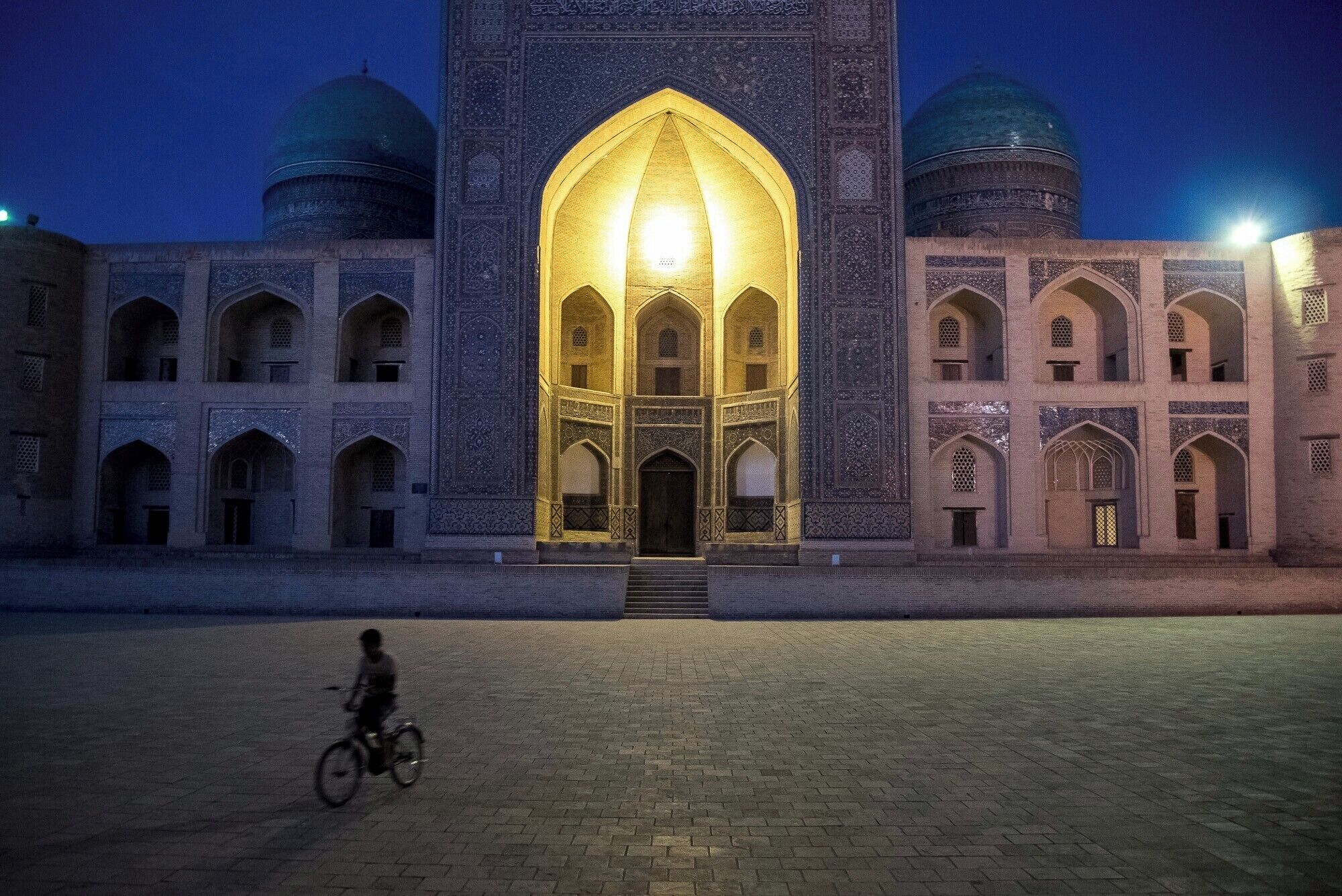 Slipping through Bukhara's courtyards at night.