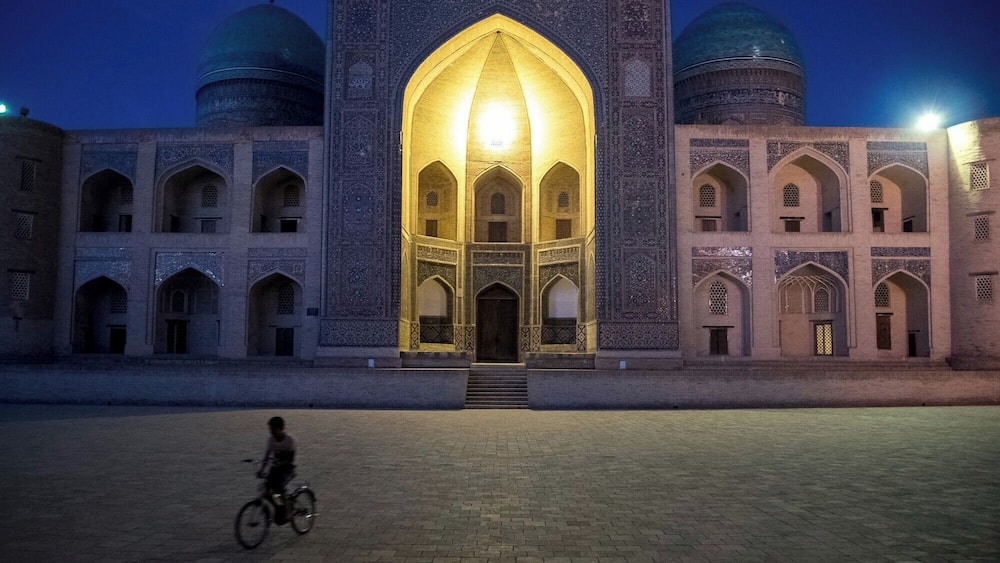 Slipping through Bukhara's courtyards at night.