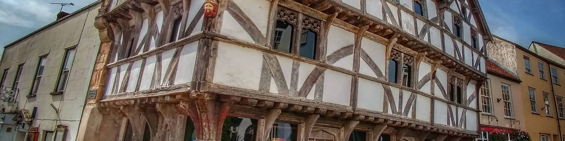 King John's Hunting Lodge is a wool-merchant's house built c. 1460 in Axbridge, a town in the English county of Somerset. It is a jettied timber-frame building of three storeys, occupying a corner plot on the town square. Wikipedia