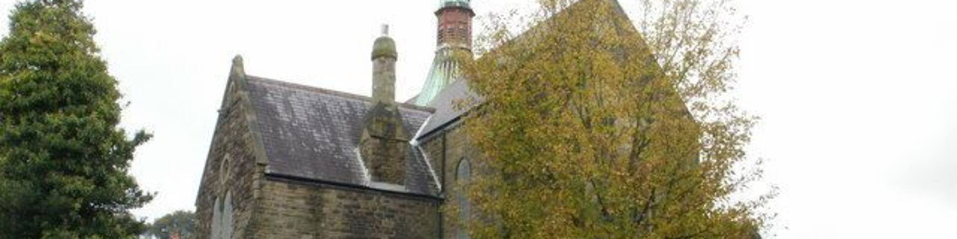 St Hilda's Church , Griffithstown, Pontypool. The view of the church from the southeast, on Kemys Street. St Hilda's Church is the Church in Wales (Anglican) parish church of Griffithstown. Built in 1887, it is a stone edifice in the Early English style, consisting of chancel, nave, aisles and south porch. 1577404 to view from the southwest.